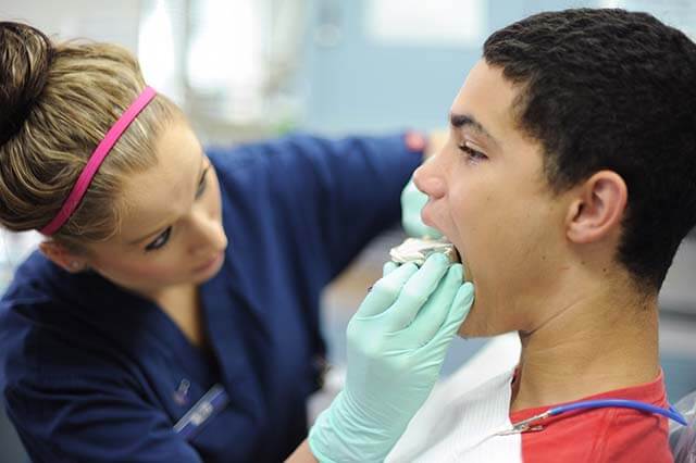 applying mouth guard