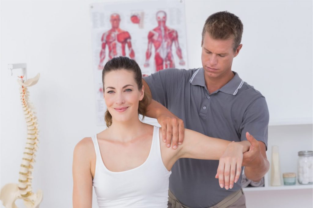 physical therapist with patient